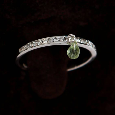 White Gold Half Eternity Diamond Thumb Ring with a Light Green Tourmaline
18ct white gold with 0.25ct of diamond